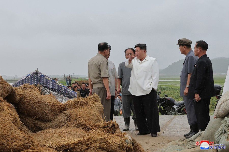 This photo, provided by North Korea's official Korean Central News Agency on Aug. 14, 2023, shows North Korean leader Kim Jong-un (C) inspecting farmland damaged by Typhoon Khanun in the North Korean county of Anbyon, Kangwon Province. (For Use Only in the Republic of Korea. No Redistribution)(IANS/Yonhap)