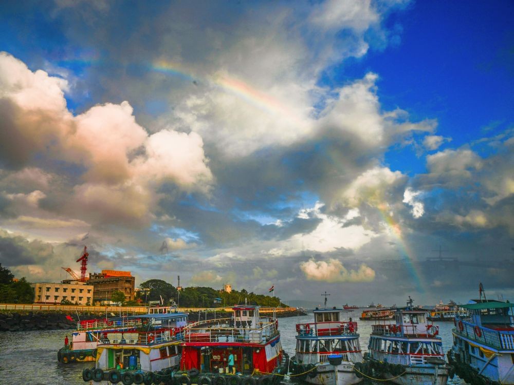Mumbai: A rainbow is seen in the sky amidst the clouds during sunset in Mumbai on Friday, August 25, 2023. (Photo: IANS)