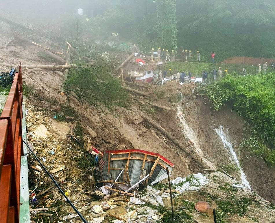 Shimla: Police Personnel carry out search and rescue operation after collapse of a temple following a massive landslide near Summer Hill in Shimla, on Monday, August 14. 2023. At least 9 people were killed according to officials. (Photo: IANS)