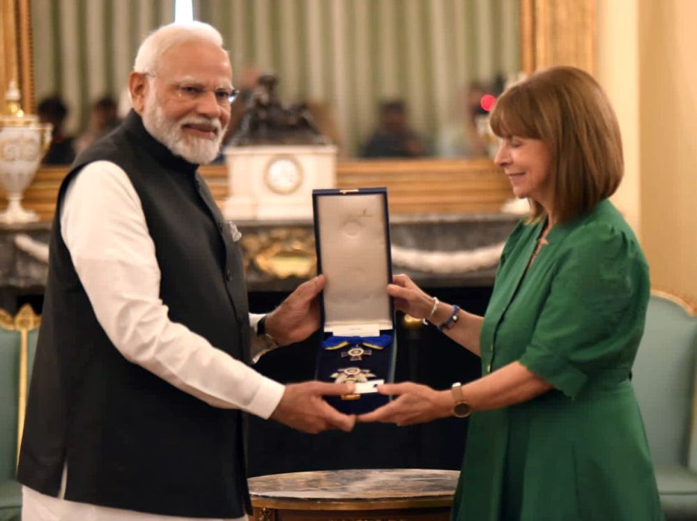 Athens: Prime Minister Narendra Modi being conferred with the 'Grand Cross of the Order of Honour' by President of Greece, Katerina Sakellaropoulou, during a meeting at the Presidential Palace in Athens, Greece, Friday, August 25, 2023. (Photo: IANS/Twitter/@narendramodi)