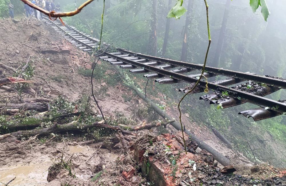 Shimla: The Kalka-Shimla railway track between Jutogh and Summerhill railway stations hanging in the air following a massive landslide caused by heavy rains, on Monday, August 14. 2023. (Photo: IANS/Twitter/@TTRHimachal)