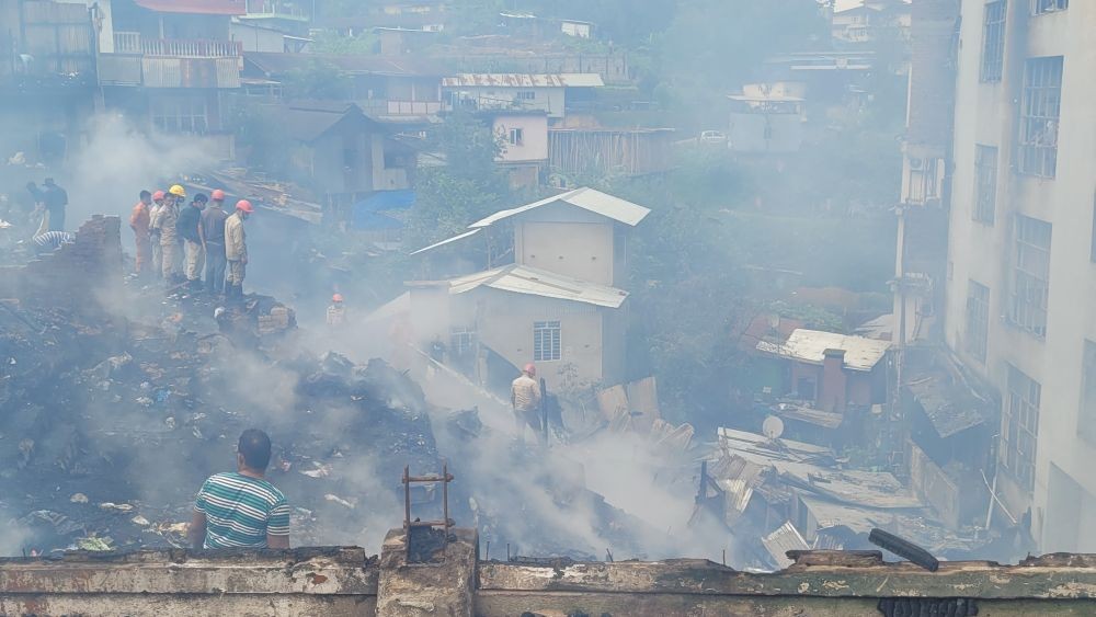 Firefighters and emergency personnel at the site of the massive fire that broke out in the in the wee hours of September 9 at Peraciezie High School Colony, Kohima. (Morung Photo)