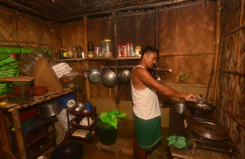 A worker prepares lunch at his rented residence in Dimapur. (Photos by Caisii Mao)