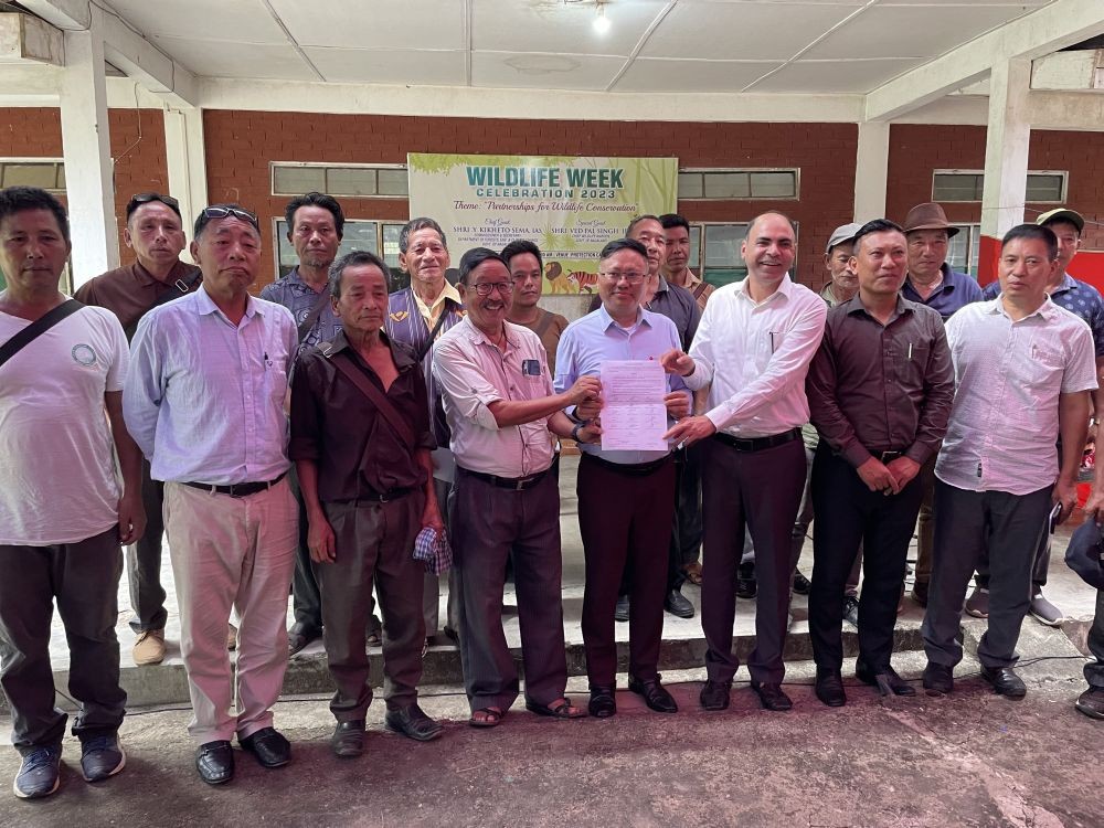 Commissioner & Secretary, Y Kikheto Sema, Department of EFCC; APCCF & CWLF, Ved Pal Singh and President, Zeliangrong Baudi (AM&N), K Akhang holding the MoU signed between the EFCC and local stakeholders pledging to protect the Intangki National Park on the occasion of Wildlife Week, 2023, at the INP Protection Camp on October 3. (Morung Photo)