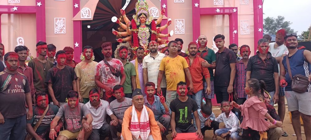 Executive members, village elders and members of Sri Sri Sarbananin Durga Puja committee, Balijan in association with Balijan youth club pose for lens before moving for immersion of images of Durga maa and other deities in Dhansiri river, Khatkhati on the last day of Vijayadashami on October 24.