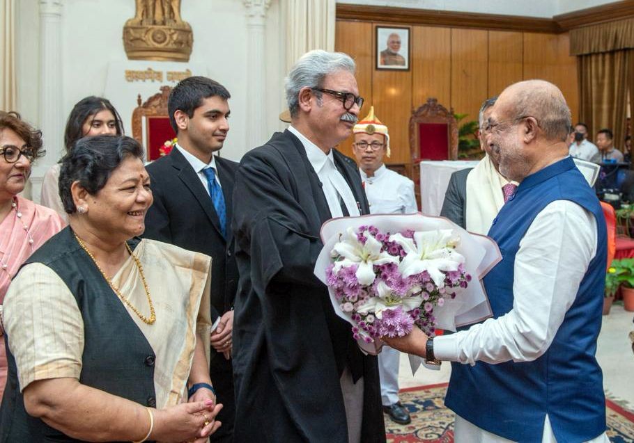 Imphal: Manipur Chief Minister N. Biren Singh greets Justice Siddharth Mridul after he was sworn in as the Chief Justice of Manipur High Court, in Imphal, Friday, Oct. 20, 2023. Governor Anusuiya Uikey is also seen.