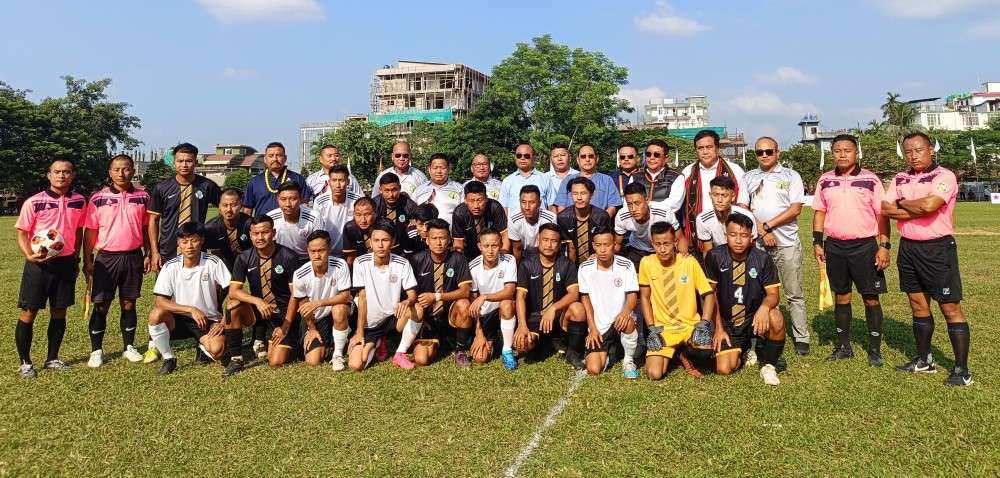Zhaleo Rio, Advisor, MAD & UD, Nagaland pose with officials and the two teams for the inaugural football match during CYO Sports 2023 at Chümoukedima Town Local Ground on October 21.