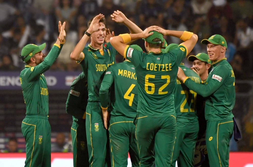 Mumbai: South Africa's Marco Jansen with teammates celebrate the dismissal of England's Joe Root during the ICC Men's Cricket World Cup match between South Africa and England at Wankhede Stadium, in Mumbai, on Saturday, October 21, 2023. (Photo: IANS)