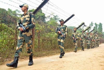 Agartala: Border Security Force (BSF) personnel patrol along the India- Bangladesh border ahead of Prime Minister Narendra Modi's public rally at Lankamura village in Agartala on Friday, Dec. 16, 2022. (Photo: Abhisek Saha/IANS)