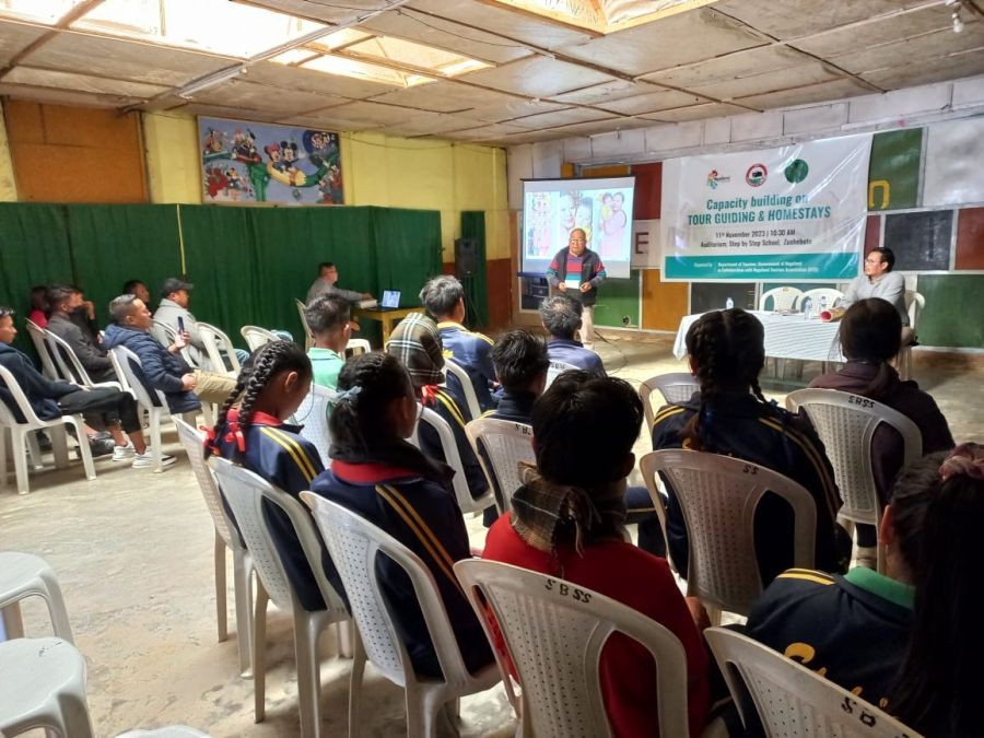 Participants and speakers during the event at Step-by-Step School Auditorium, Zunheboto.