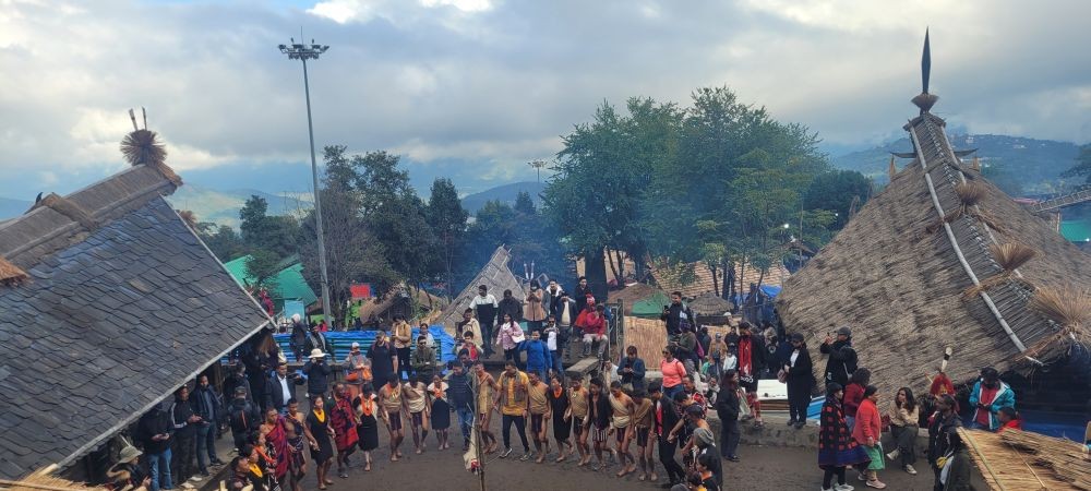 Tourists mingle with dancers around the Morungs during 24th Hornbill Festival 2023 at Naga Heritage Village, Kisama. (Morung Photo)