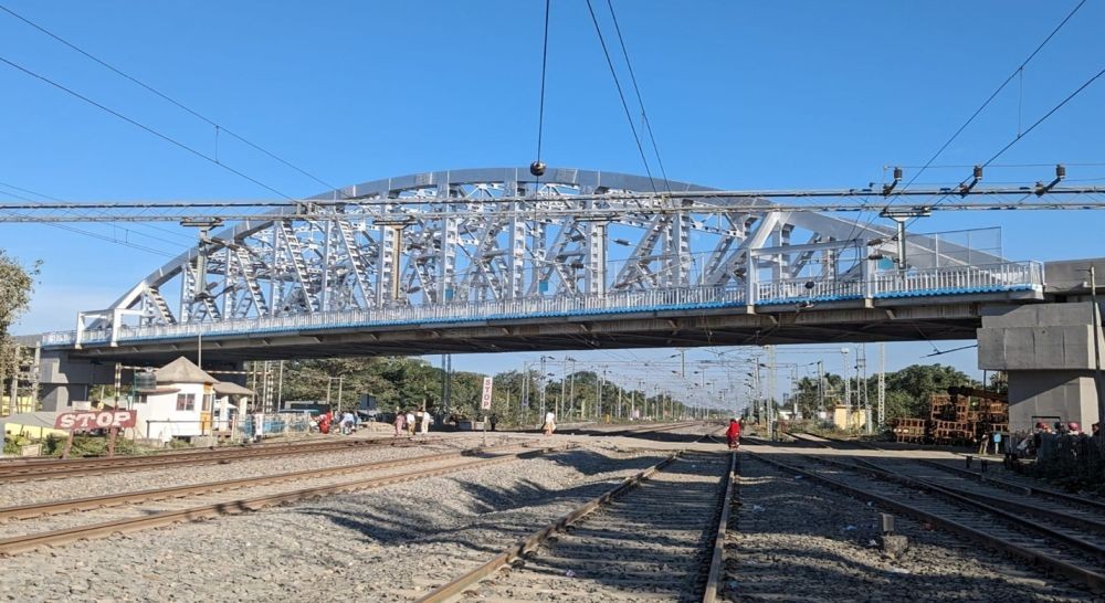 A Road Over Bridge is seen above rail tracks somewhere in the NFR jurisdiction. As per an official release, a total of 219 ROBs & 640 RUBs had been constructed across Northeast Frontier Railway over the past decade from 2014 to 2023. (Photo Courtesy: CPRO NFR)