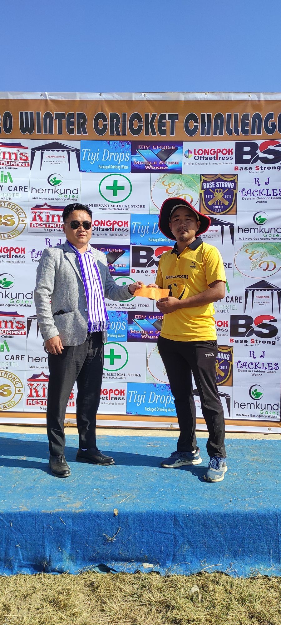 Patron of the day- Shanjothung AA Ezung, President BJP ST Morcha Wokha unit seen felicitating the man of the match.