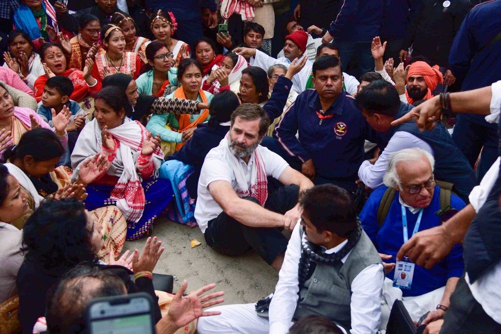 Nagaon: Congress leader Rahul Gandhi with party leaders and supporters sits in protest after he was not allowed to visit the Sri Sri Sankar Dev Satra during the Bharat Jodo Nyay Yatra, in Nagaon district on Monday, Jan. 22, 2024. (Photo: IANS/Anuwar Hazarika)