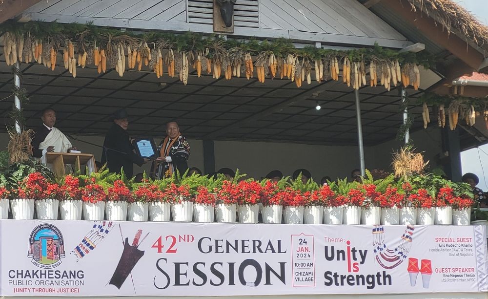 Küdecho Khamo hand over certificate of appreciation to one of villages during 42nd General Session of CPO at Chizami on January 24. (Morung Photo)