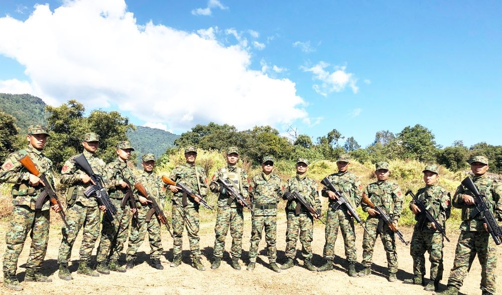 In a photo handout, Myanmar based NSCN –K president Yung Aung is seen with armed cadres during the 45th Raising Day celebration at an undisclosed location in Myanmar.
