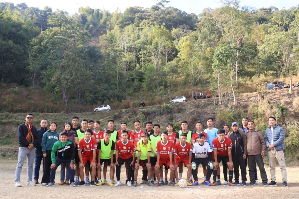 Mezoma Students’ Union officials pose for lens with match official and players before the final match on January 4.