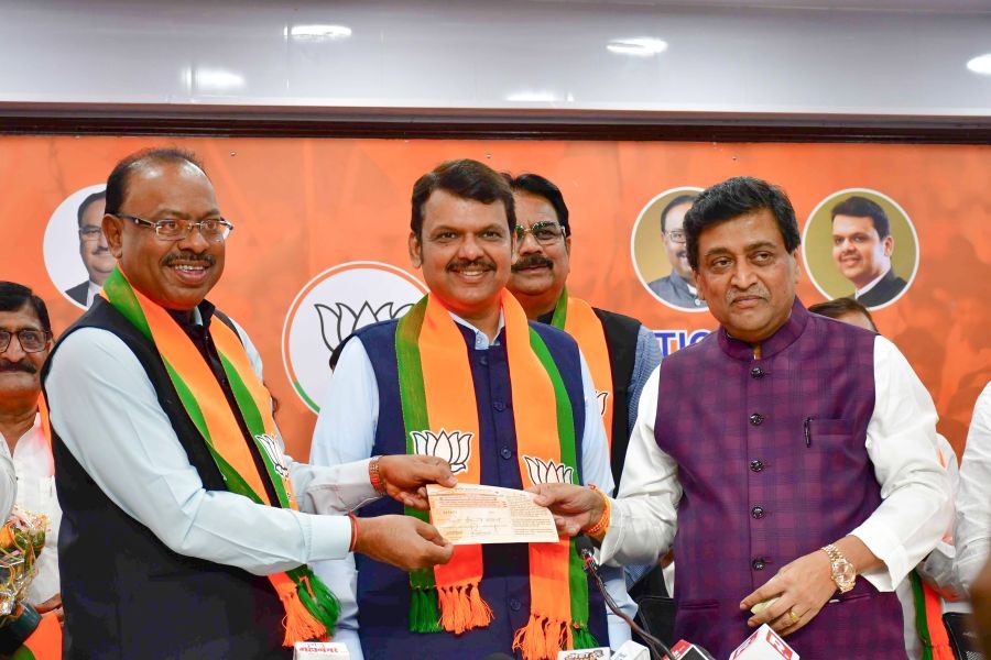 Former Maharashtra CM Ashok Chavan joins the BJP in the presence of Maharashtra Deputy CM Devendra Fadnavis and State President Chandrashekhar Bawankule at the party's office in Mumbai on Tuesday, Feb. 13, 2024. (Photo: IANS/Nitin Lawate)