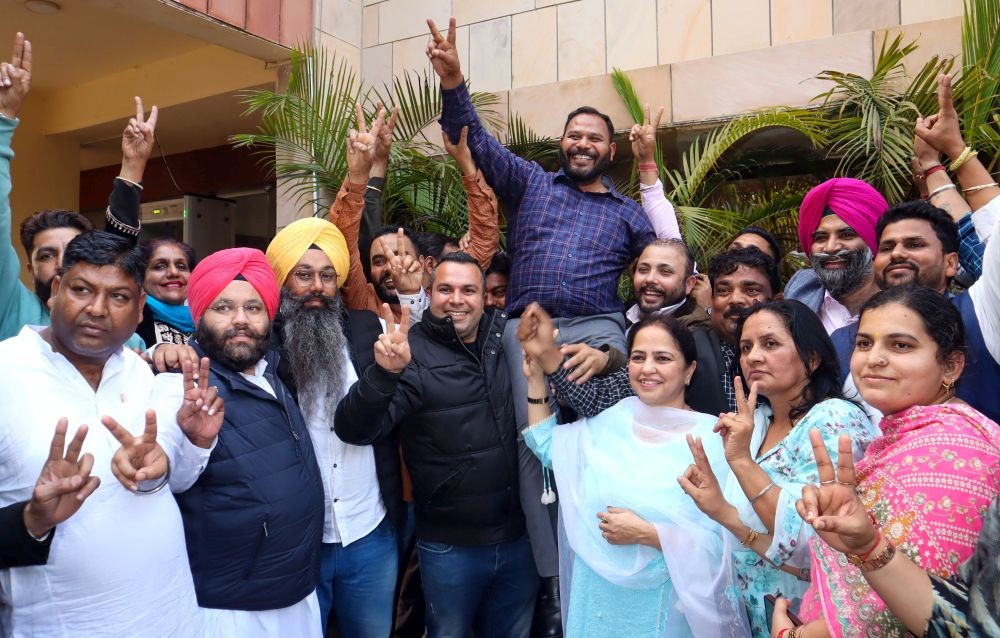 Chandigarh: AAP councillor Kuldeep Kumar celebrates with party members after the Supreme Court declared him as winner and Mayor of union territory of Chandigarh, in Chandigarh, Tuesday, Feb. 20, 2024.(IANS)