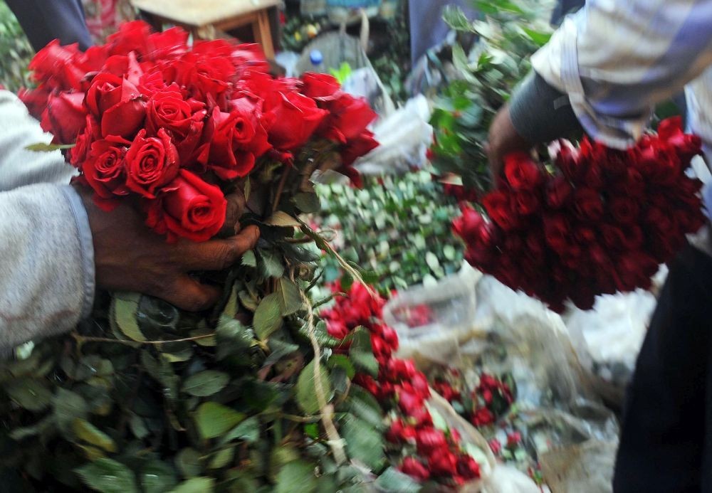 Rose farmers from neighbouring villages sell roses at the wholesale market in Kolkata. Rose is on high demand today for Valentine`s Day on Feb. 14. (Photo: Kuntal Chakrabarty/IANS)