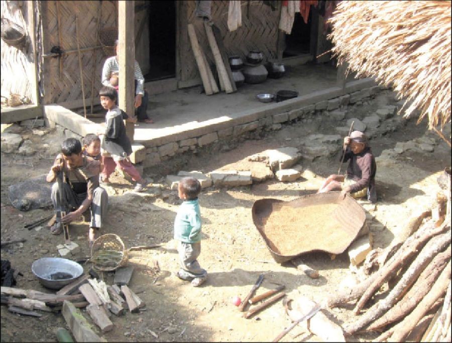 Children in Chaoha village in Mon district play outside their house as elders keep busy with their regular chores. Despite the right to free and compulsory education, many children from villages in Mon are deprived of this basic right as parents continue to use them for manual work. Child trafficking is also increasing in this part of the state. (Morung File Photo)