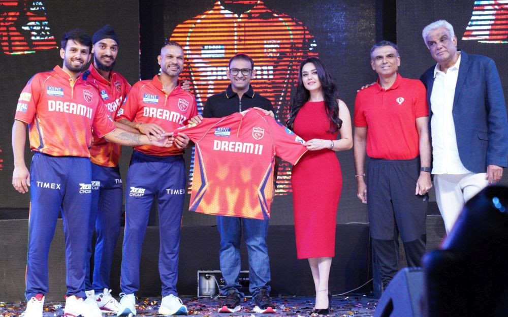 Chandigarh: Punjab Kings co-owner Preity Zinta with captain Shikhar Dhawan, player Arshdeep Singh and others during the unveiling of Punjab King's new jersey at Elante Mall, Chandigarh on Saturday, March 16, 2024.(IANS/Ajay Jalandhari)