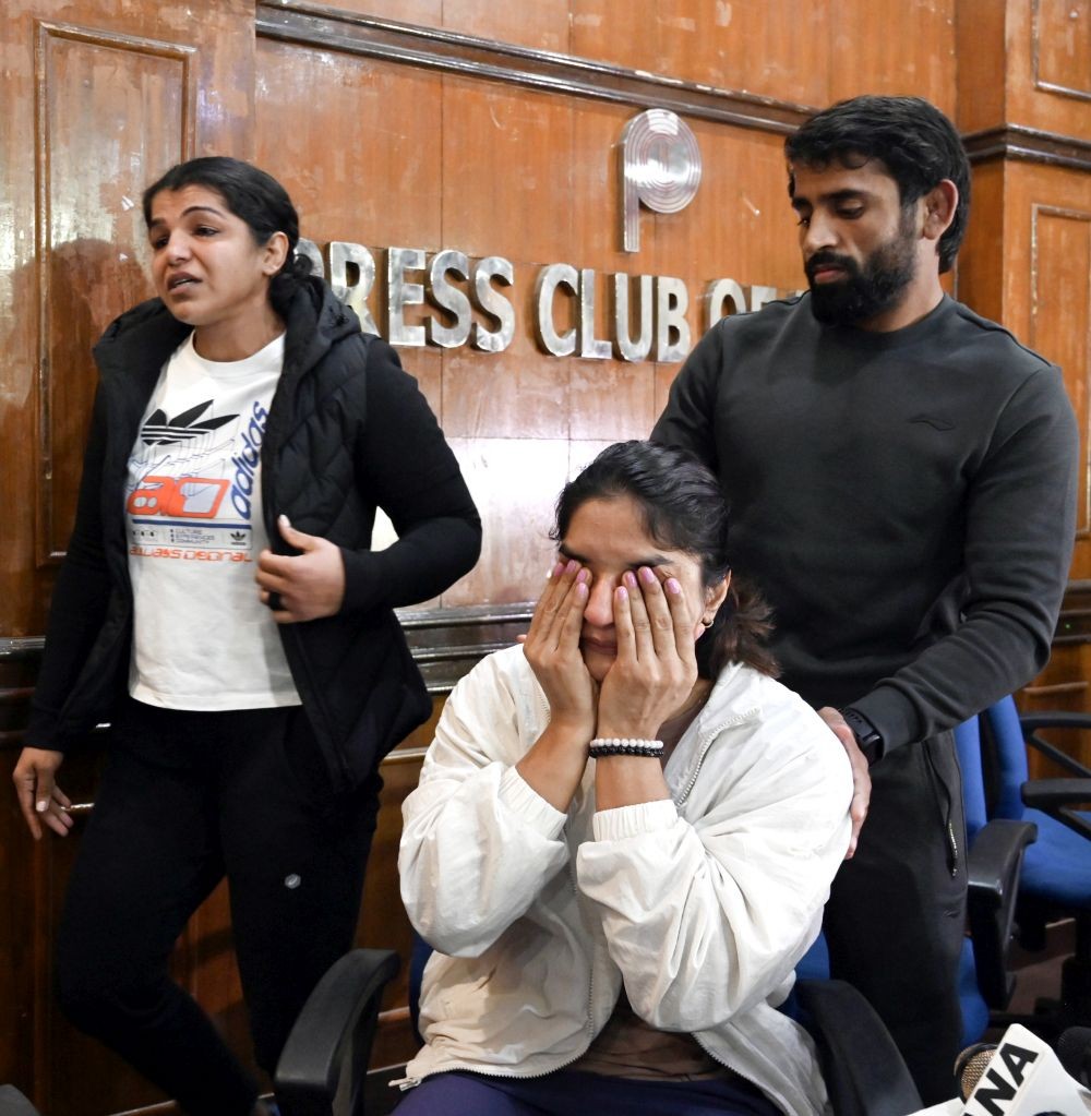 New Delhi: Wrestler Sakshi Malik, Bajrang Punia and Vinesh Phogat react during a press conference at Press Club after WFI chief Brij Bhushan Sharan Singh's aide Sanjay Singh elected as the new president of the WFI, in New Delhi on Thursday, December 21, 2023. Sakshi Malik said she will not be competing in wrestling anymore following Sanjay Singh's victory as Wrestling Federation of India (WFI) president. (Photo: IANS)