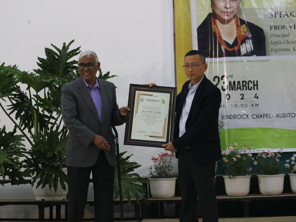 Zonal Secretary, UESI, NE Zone, A Lanu Tzudir receives the AAPCC’s 3rd Annual Alumni Excellence Award from Rev Dr Tuisem A Shishak, Founder and Principal Emeritus of PCC-A on March 23. (Photo Courtesy: PCC Mass Comm)