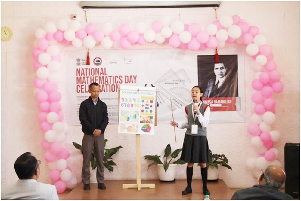Presenter from Mezhür Hr Sec School and her guide teacher with their winning presentation.
