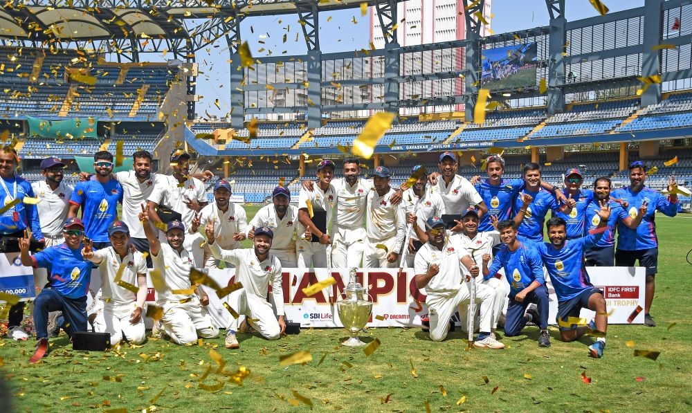 Mumbai: Mumbai players celebrate with the championship trophy after winning the Ranji Trophy final test cricket match between Mumbai and Vidarbha, at the Wankhede Stadium, in Mumbai, Thursday, March 14, 2024. Mumbai beat Vidarbha by 169 runs to clinch their record-extending 42nd Ranji Trophy title.(IANS)