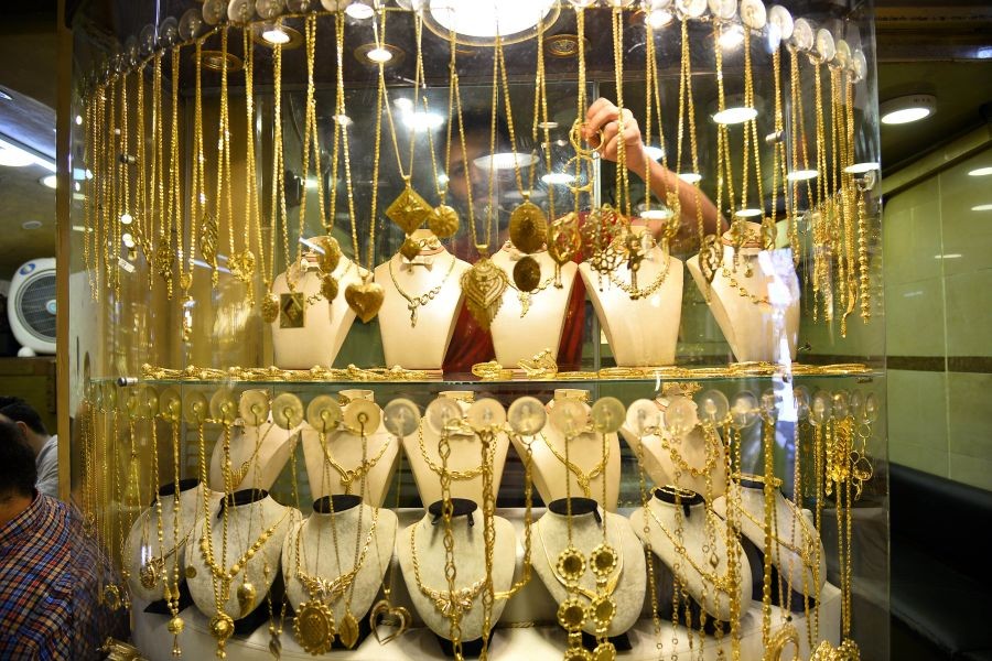 A merchant displays gold crafts at a gold market in Gaza City, July 8, 2019. The Ministry of National Economy in Gaza said that the quantities of gold decreased during the month of June. (Str/Xinhua/IANS)