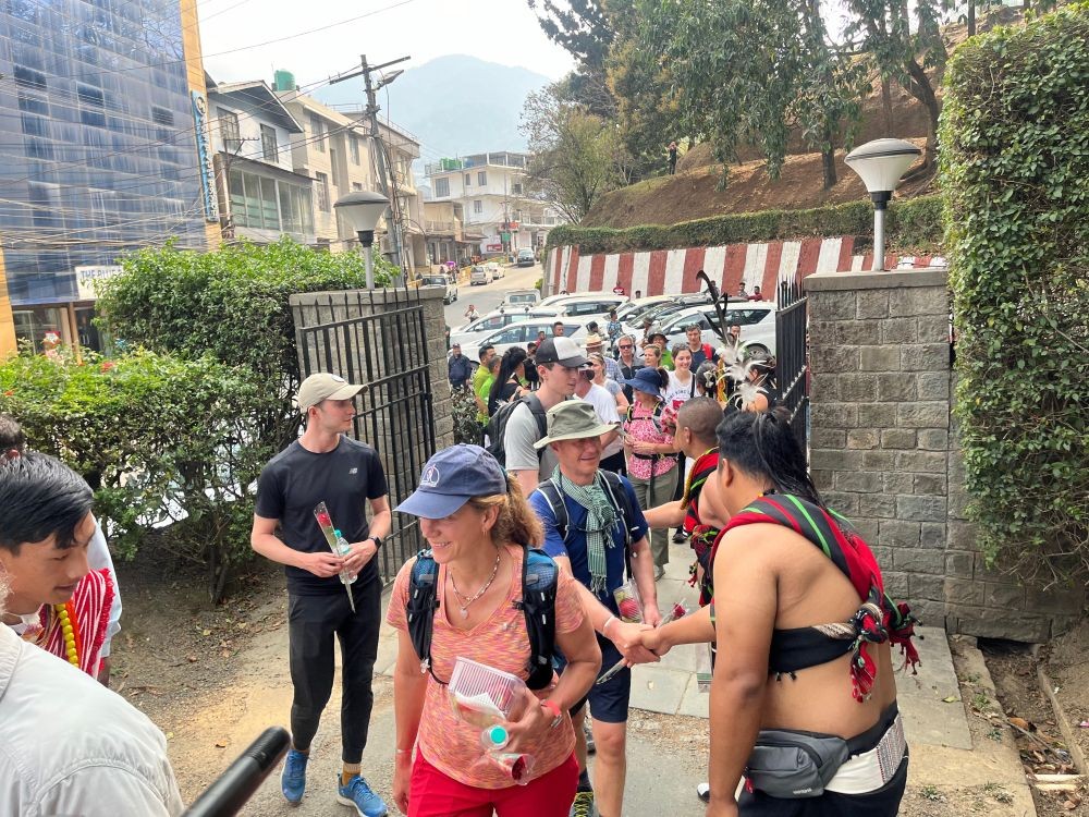 Members of the British team in the '39 Hours -Walking in My Grandfather’s Footsteps' reach World War II Cemetery, Kohima, the final stop of their journey from Jessami on April 3. (Morung Photo)