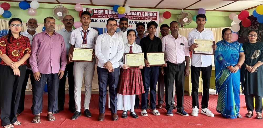 Officials and others with the four rank holders in the HSLC Examination 2024 from MGM Higher Secondary School during the felicitation programme.