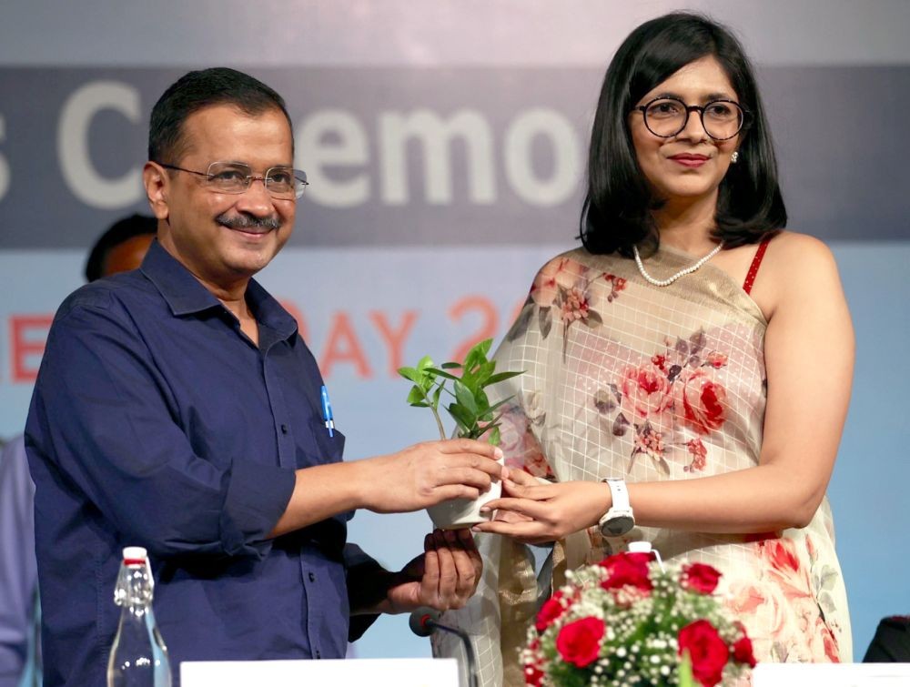 New Delhi : Chief Minister Arvind Kejriwal with DCW Chief Swati Maliwal at DCW International Women's Day Awards 2023 in New Delhi on Saturday , March 11, 2023.(Photo:IANS/Twitter)