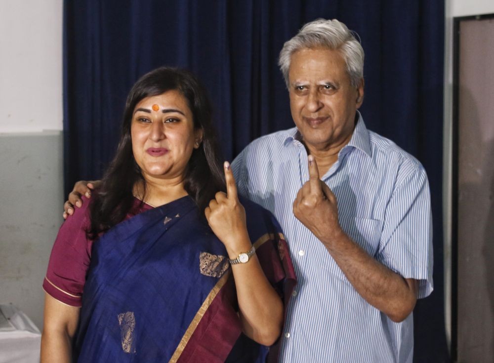 New Delhi: BJP candidate Bansuri Swaraj and her father, former governor Swaraj Kaushal, show their ink-marked fingers after casting their votes in the sixth phase of the Lok Sabha elections in New Delhi on Saturday, May 25, 2024. (Photo: IANS/Wasim Sarvar)
