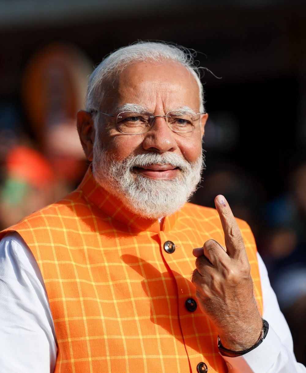 Ahmedabad: Prime Minister Narendra Modi shows his ink-marked finger after casting his vote at a polling station during the third phase of Lok Sabha elections, in Ahmedabad, Tuesday, May 7, 2024.(IANS)