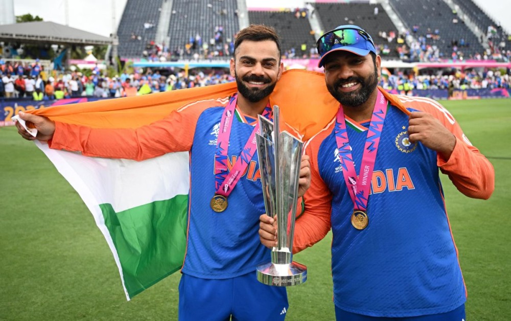 Barbados : India's Virat Kohli and Rohit Sharma pose with the trophy after India won the ICC Men's T20 Cricket World Cup Final match against South Africa at Kensington Oval in Barbados on Saturday, June 29, 2024. (Photo: IANS/@ICC)