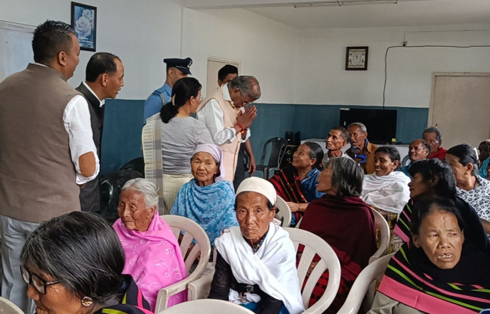 Nagaland Governor La Ganesan interacting with elderly people at the Good Samaritan Senior Citizen's Home in Meriema on June 21.