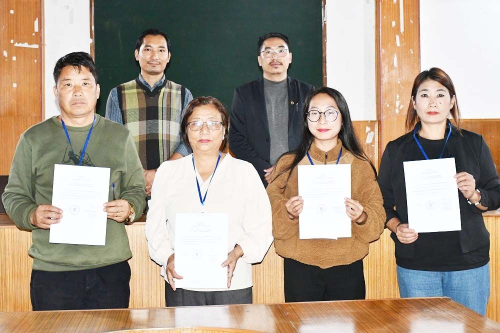 Four candidates who were declared unopposed for the Wokha Town Council with their election certificates on June 18. (DIPR Photo)