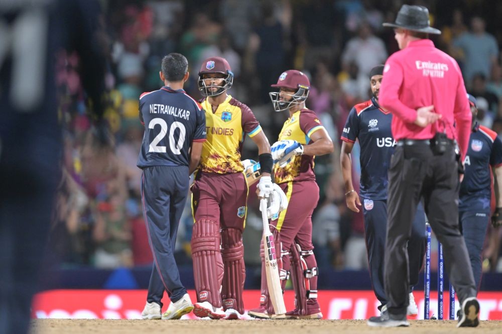 Barbados : United States' Saurabh Netravalkar congratulates West Indies' Shai Hope at the end of the ICC Men's T20 World Cup cricket match at Kensington Oval in Barbados on Saturday, June 22, 2024. (Photo: IANS)