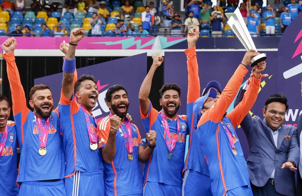Barbados : Players of team India pose with the tropy after India won the ICC Men's T20 Cricket World Cup Final match against South Africa at Kensington Oval in Barbados on Saturday, June 29, 2024. (Photo: IANS)