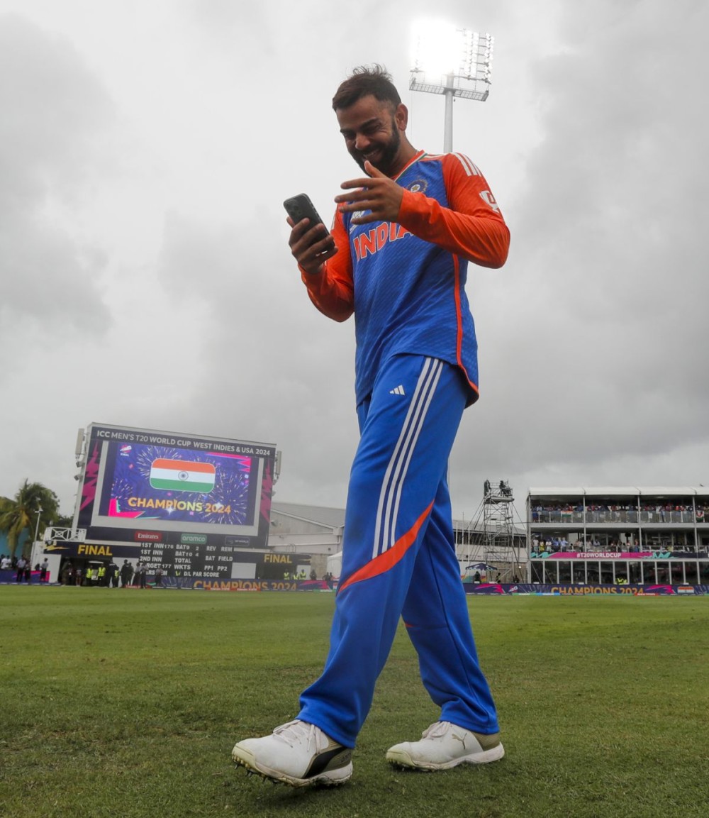Barbados : India's Virat Kohli on a phone call after India won the ICC Men's T20 Cricket World Cup Final match against South Africa at Kensington Oval in Barbados on Saturday, June 29, 2024. (Photo: IANS)