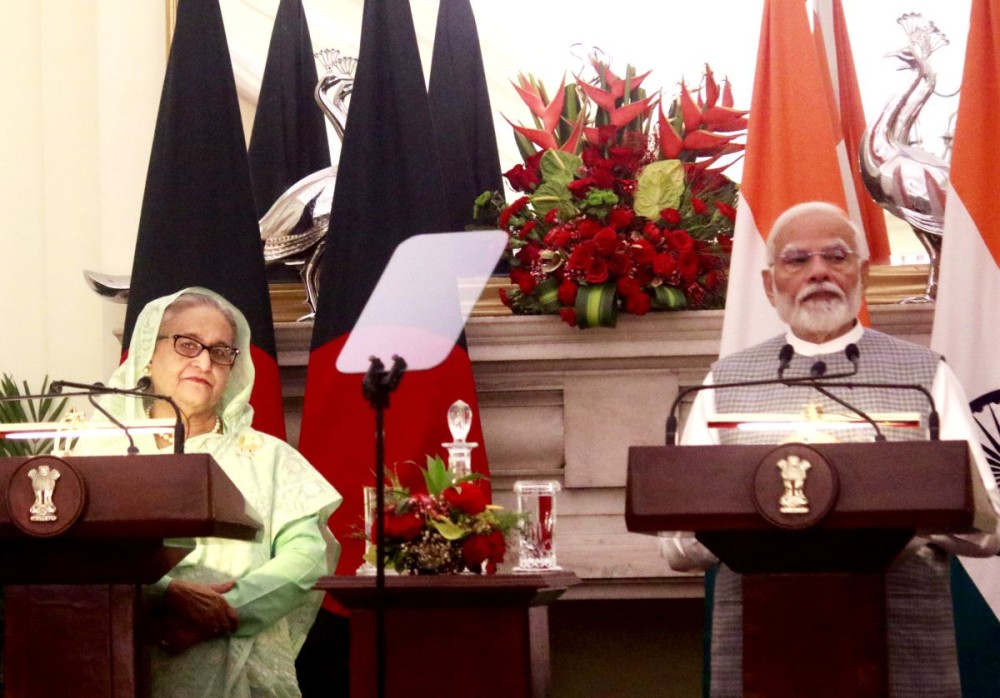 New Delhi:Bangladesh Prime Minister Sheikh Hasina,with Prime Minister Narendra Modi during a press statement after their delegation level meeting in New Delhi,on Saturday, June 22, 2024.(Photo:IANS/Qamar Sibtain)