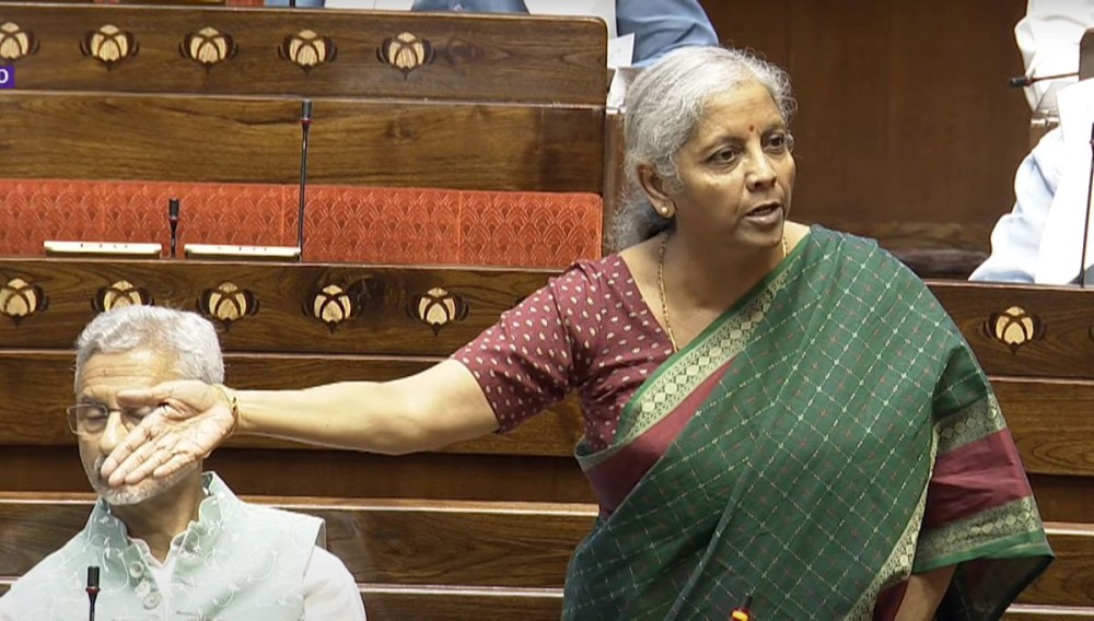 New Delhi:  Union Finance Minister Nirmala Sitharaman speaks in the Rajya Sabha as External Affairs Minister Dr. S. Jaishankar looks on during the monsoon session of Parliament in New Delhi on Wednesday July 24 2024. (Photo: IANS/Sansad TV)