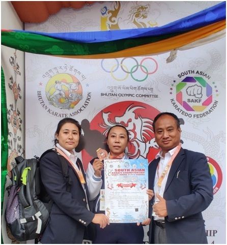 From left to right: Renshi Soibam Bindeshori Chanu, Technical Secretary of ISKF-INDIA as Female Official; Akumienla Limanungsang Imchen; and Kyoshi Mutum Bankim, Chief of International Shito Ryu Karate Federation, India.