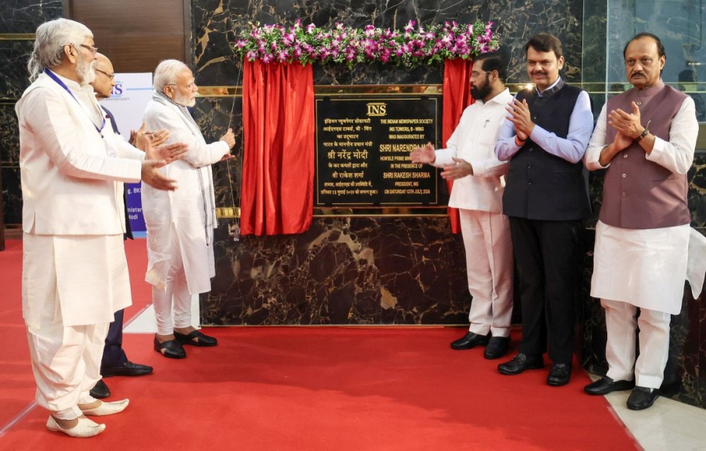 Mumbai : Prime Minister Narendra Modi with Maharashtra Governor Ramesh Rais, Chief Minister Eknath Shinde and state DY CMs Ajit Pawar and Devendra Fadnavis and others during the inauguration of Indian Newspapers Society Towers, in Mumbai on Saturday, July 13, 2024.(IANS)