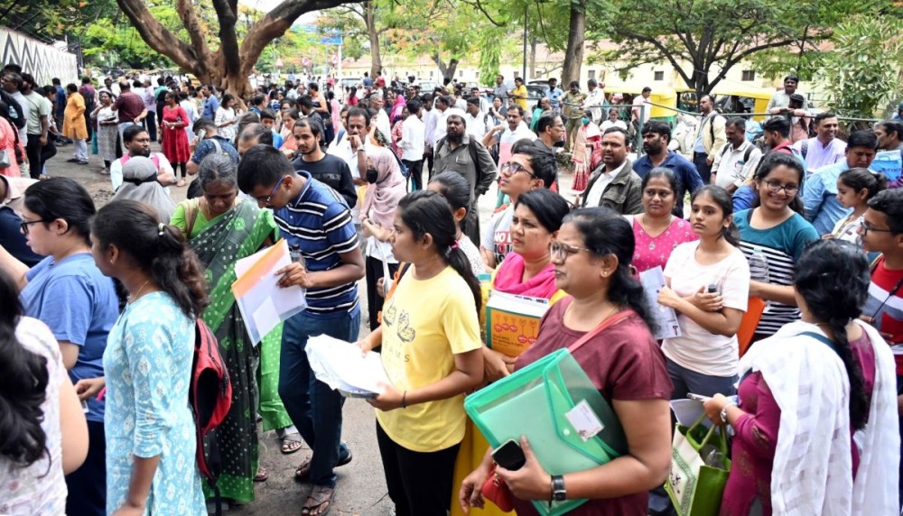 Bengaluru: Students wait outside before entering the examination centre to appear in the NEET-UG exam, in Bengaluru, on Sunday, May 7, 2023. (Photo:  Dhananjay Yadav/IANS)