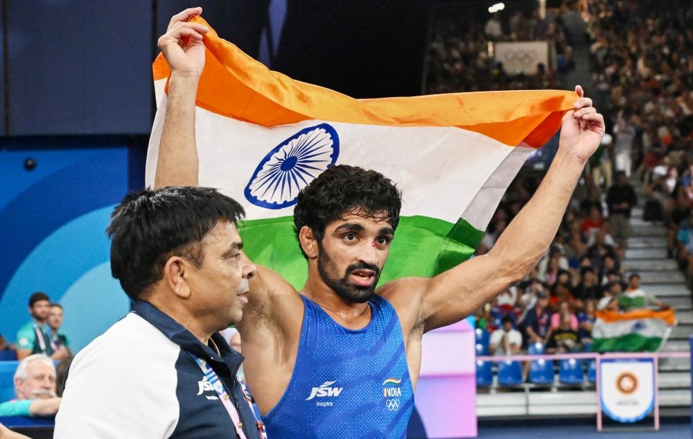 Paris: India's Aman Sehrawat celebrates winning in the men's freestyle 57kg bronze medal wrestling match against Puerto Rico's Darian Tai Cruz at the Paris Olympics 2024, in Paris, France, on Friday, August 9, 2024. (Photo: IANS)
