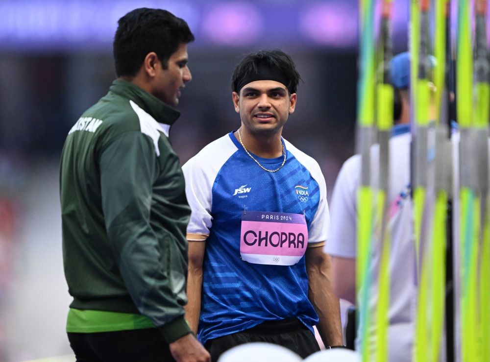 Saint-Denis: India's Neeraj Chopra in a conversation with Pakistan's Arshad Nadeem during the men's javelin throw qualification match at the 2024 Summer Olympics in Saint-Denis, France on Tuesday August 06, 2024. (Photo: IANS/Biplab Banerjee)