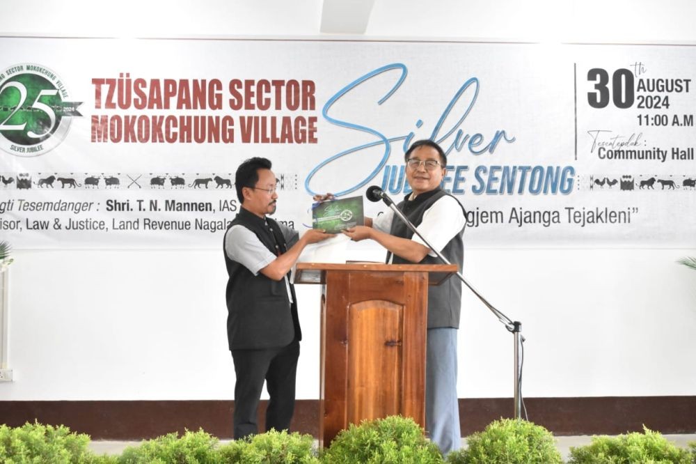 T N Mannen, IAS (Retd.), Advisor for Law & Justice and Land Revenue, Government of Nagaland unveiling the Jubilee souvenir book.